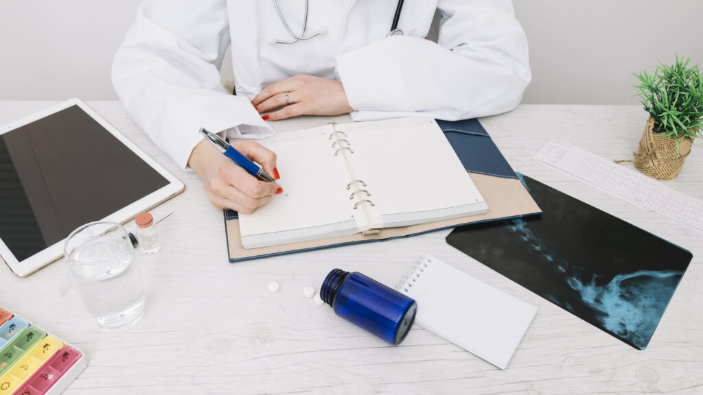 crop doctor writing notebook